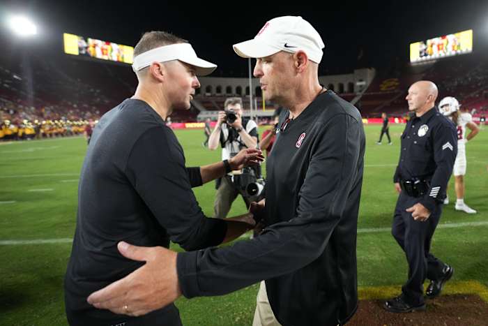 Sep 9, 2023; Los Angeles, California, USA; Southern California Trojans head coach Lincoln Riley (left) talks with Stanford Cardinal head coach Troy Taylor after the game at United Airlines Field at Los Angeles Memorial Coliseum. Mandatory Credit: Kirby Lee-USA TODAY Sports